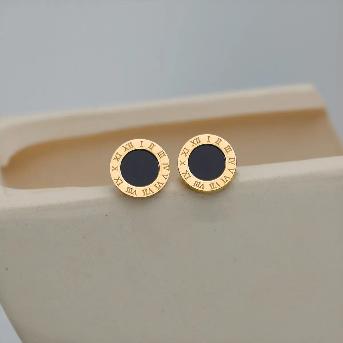 Gold stud earrings